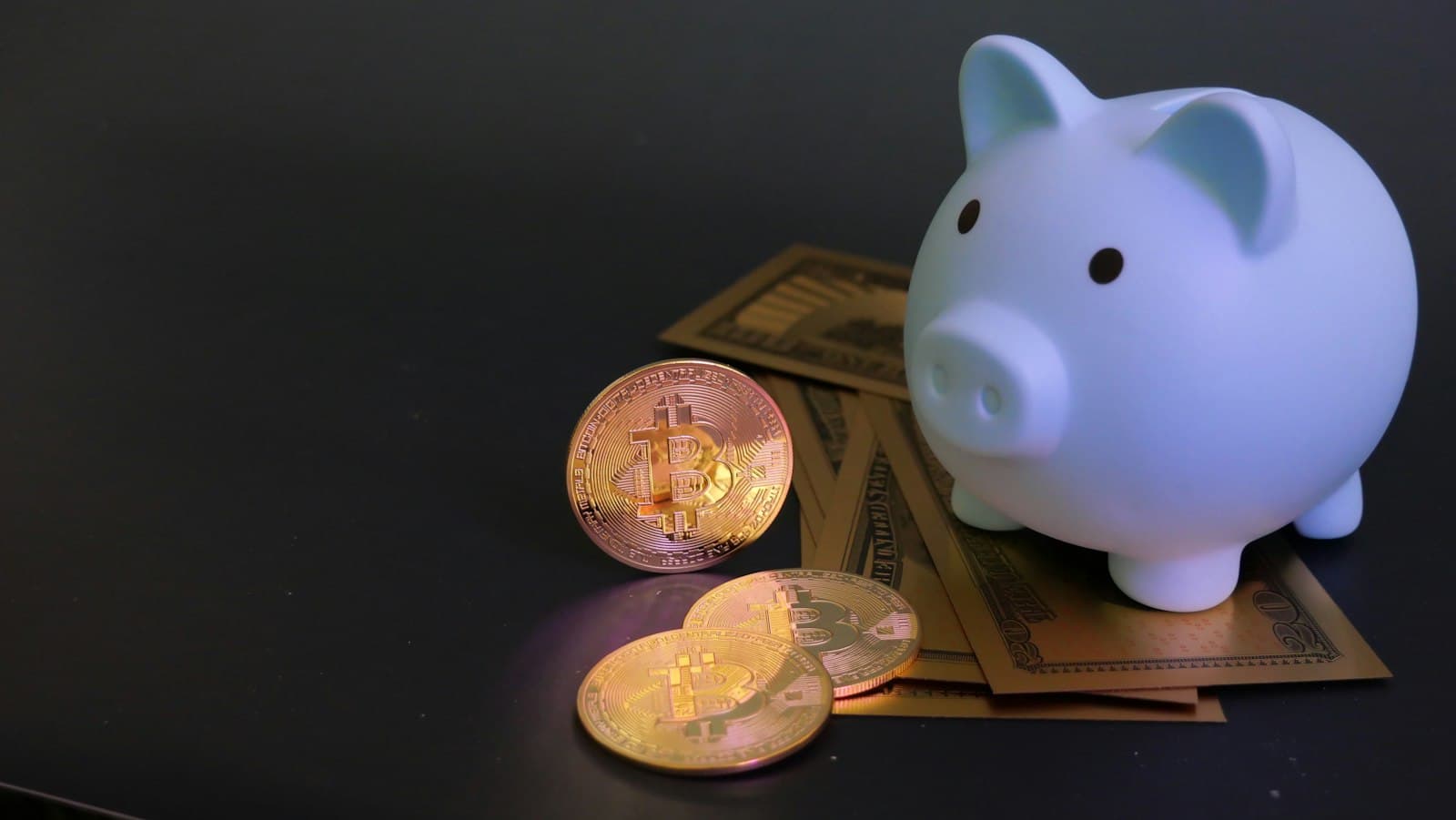A piggy bank surrounded by coins and paper money on a table